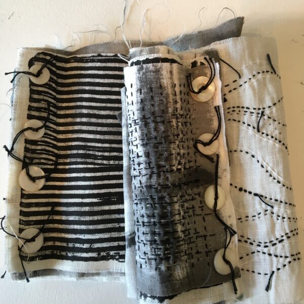 cloth to codex, fabric and paper books, hand stitched
